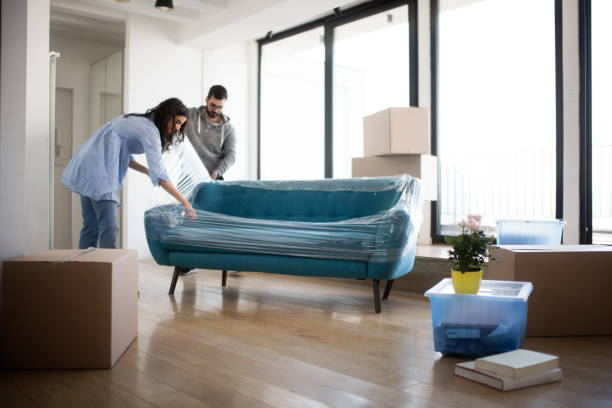 Couple moving sofa | PDJ Flooring